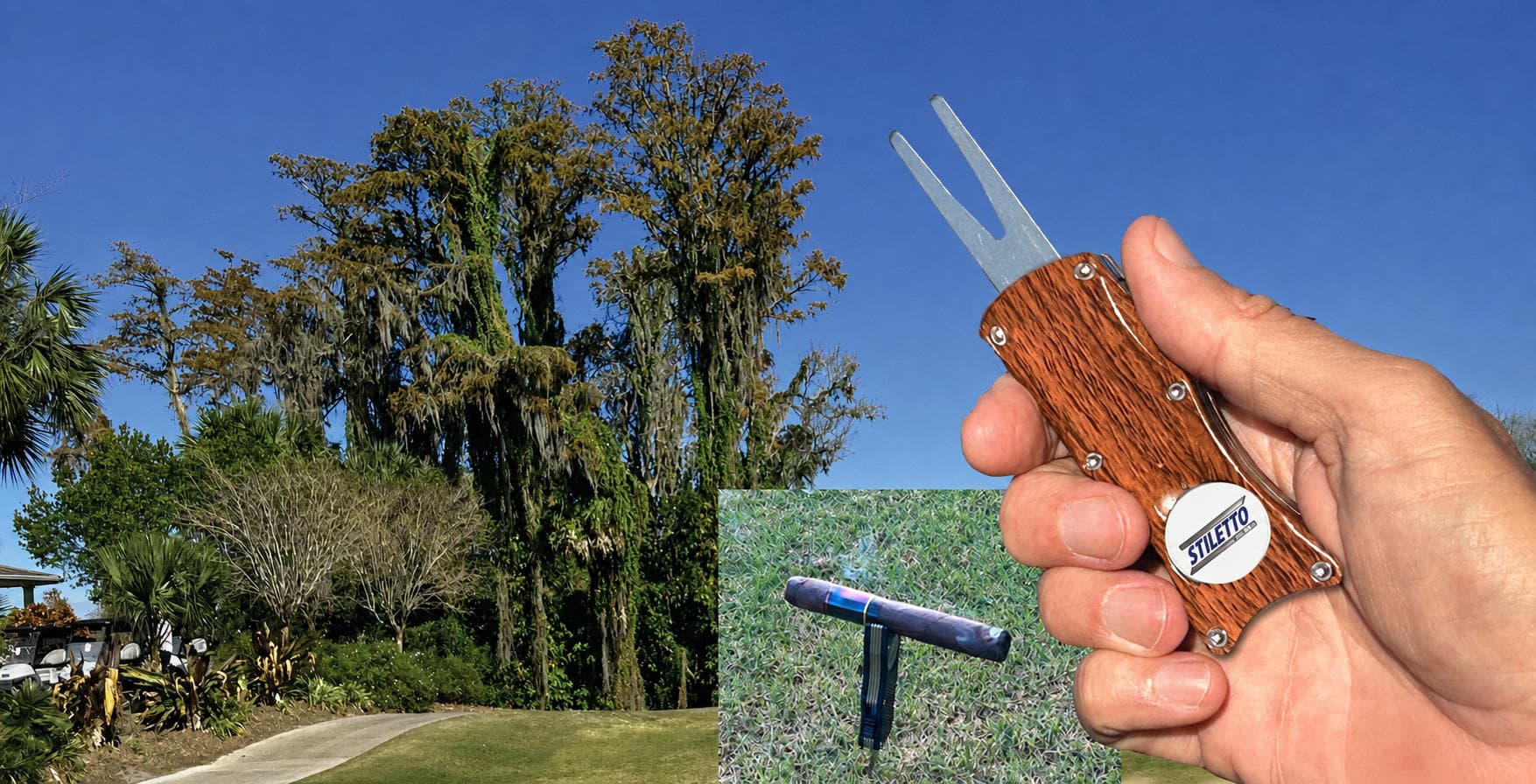A hand holding the Stiletto Switchblade ball mark repair tool with its fork ejected, overlooking a golf course green